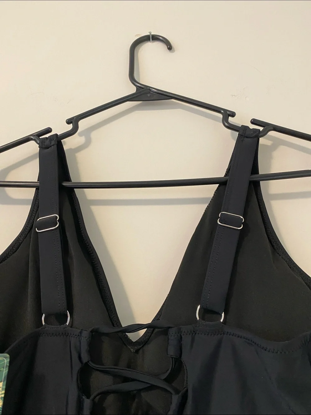 Black One-Piece Swimsuit with White Side Panels and surprising back detail.